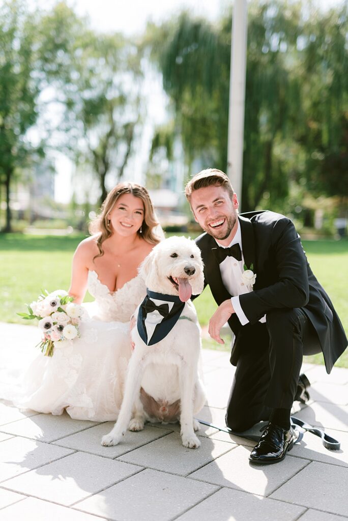 Couple taking wedding photos with their dog, Navy Yard Waterfront